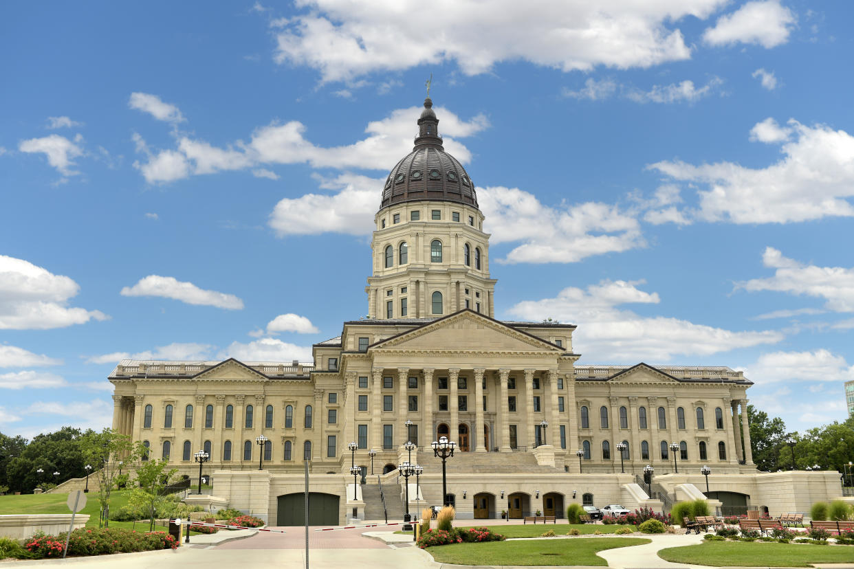 External view of the Kansas State Capitol., with its dome and columned portico. 