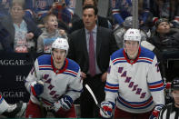 FILE - New York Rangers head coach David Quinn watches his team play against the Dallas Stars with center Brett Howden (21) and right wing Kaapo Kakko (24) during the third period of an NHL hockey game in Dallas, in this Tuesday, March 10, 2020, file photo. The New York Rangers fired coach David Quinn and three assistant coaches Wednesday, May 12, 2021, after missing the playoffs with one of the NHL's up-and-coming young teams. (AP Photo/Michael Ainsworth, File)