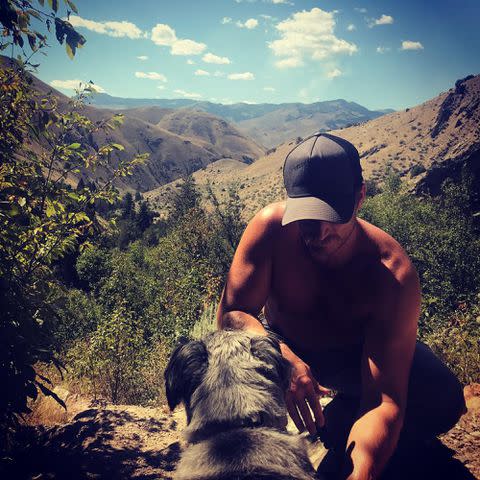 <p>Kelly Reilly Instagram</p> Kelly Reilly's husband Kyle Baugher with their dog.