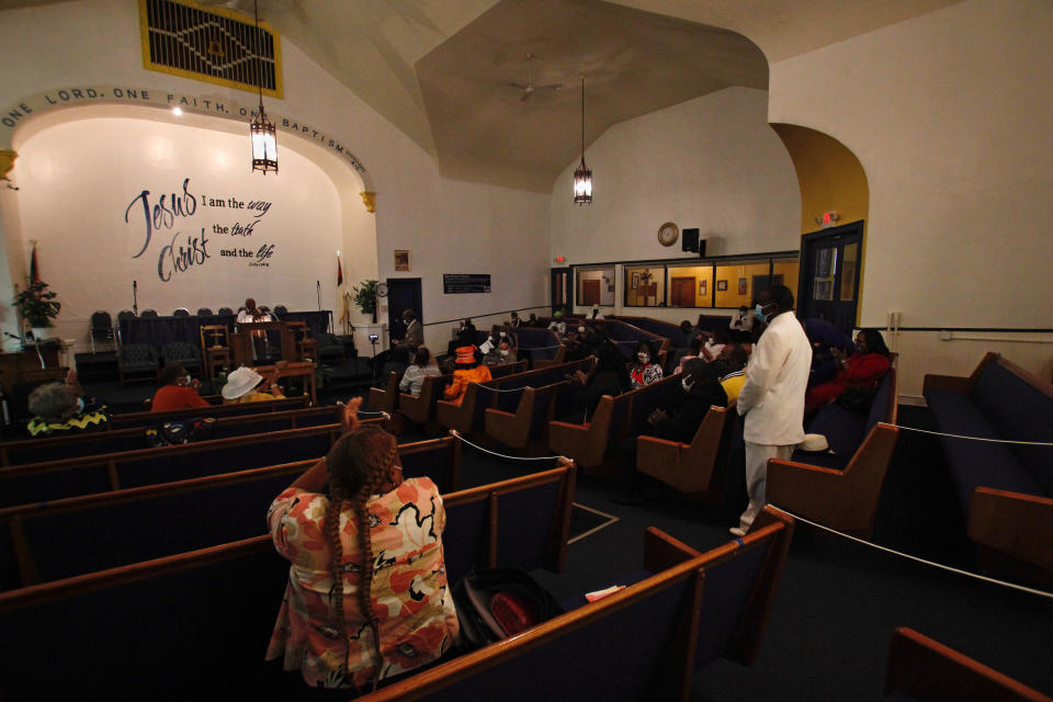 In this May 9, 2021, photo, Rev. Joseph Jackson Jr. talks to his congregation at Friendship Missionary Baptist Church in Milwaukee during a service. He is president of the board of directors for Milwaukee Inner City Congregations Allied for Hope, which along with Pastors United, Souls to the Polls and the local health clinic Health Connections is working to get vaccination clinics into churches to help vaccinate the Black community. He's also been urging his congregation during Sunday services to get vaccinated. (AP Photo/Carrie Antlfinger)