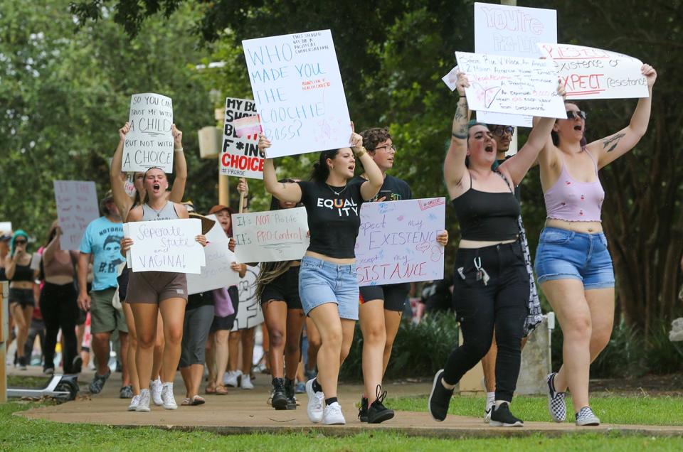 Hundreds of people protested the Supreme Court striking down of Roe V Wade during a pro choice rally and march through downtown Fort Walton Beach.