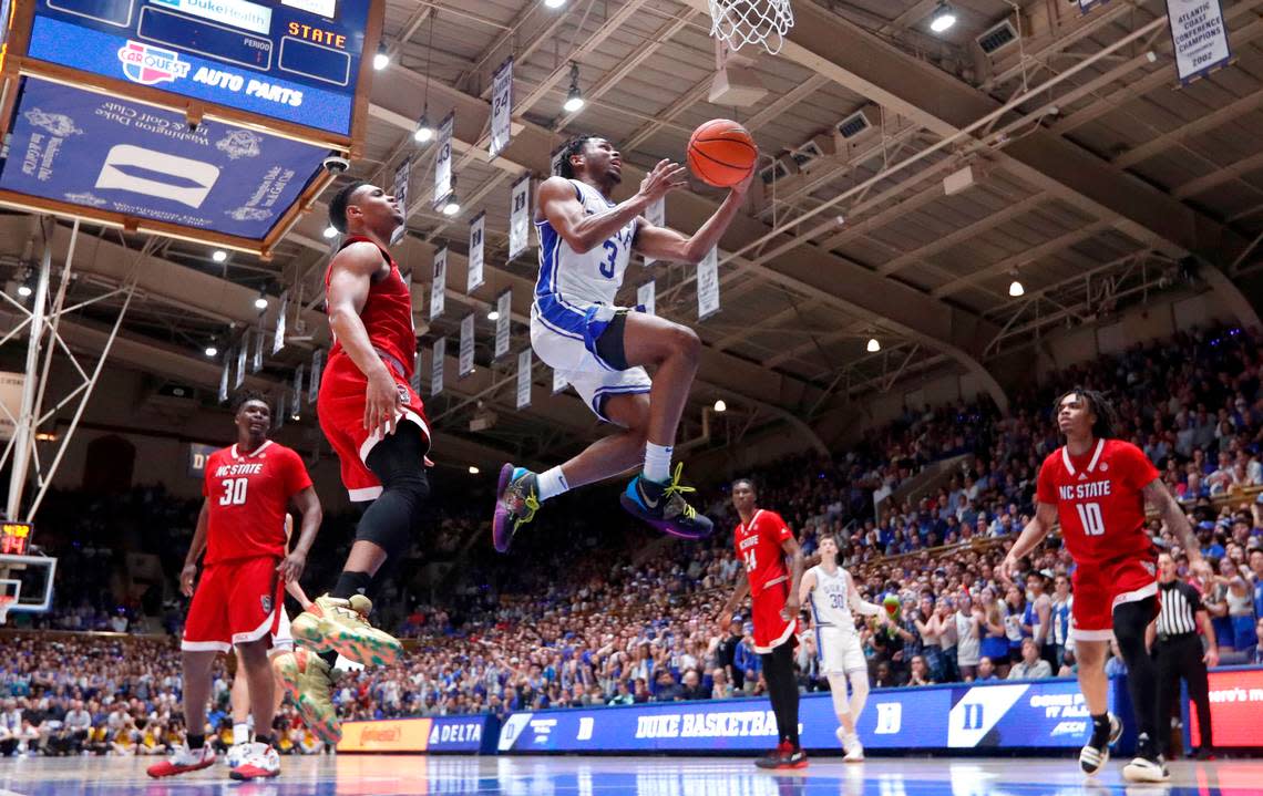 Duke’s Jeremy Roach (3) drives past N.C. State’s Casey Morsell (14) to the basket during Duke’s 71-67 victory over N.C. State at Cameron Indoor Stadium in Durham, N.C., Tuesday, Feb. 28, 2023.