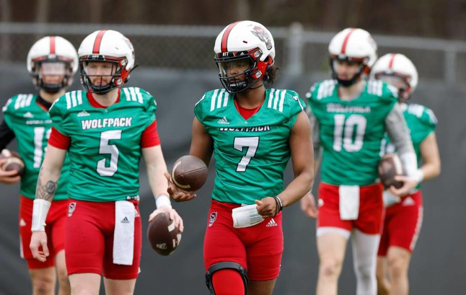 N.C. State quarterback MJ Morris (7) leads the quarterback group, including Brennan Armstrong (5), during the Wolfpack’s first spring practice in Raleigh, N.C., Wednesday, March 1, 2023.