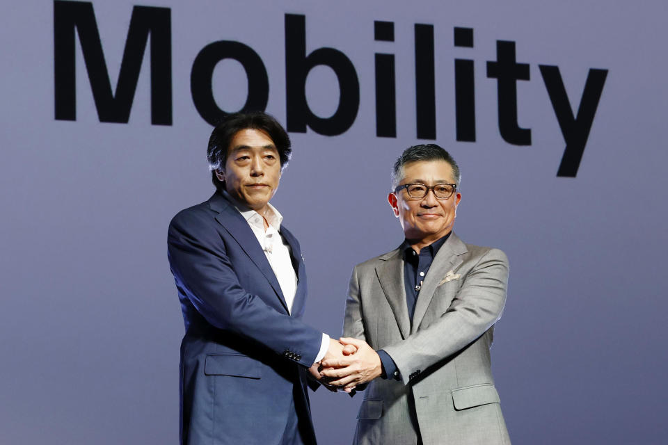 Izumi Kawanishi, left, the Sony executive who became Chief Operating Officer at Sony Mobility and Chief Executive Yasuhide Mizuno pose for a photo during a news conference in Tokyo Thursday, Oct. 13, 2022. A new electric car company that brings together two big names in Japanese business, Honda and Sony, officially kicked off Thursday, with both sides stressing their common values of taking up challenges and serving people’s needs. (Takuto Kaneko/Kyodo News via AP)