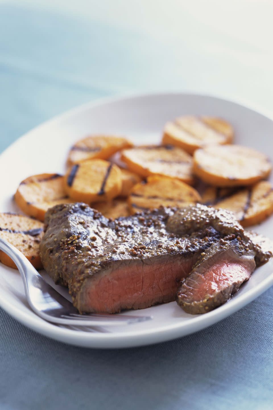 <p>Serve 3 ounces broiled or grilled flank steak with one baked <a href="https://www.goodhousekeeping.com/health/diet-nutrition/a48026/sweet-potato-nutrition/" rel="nofollow noopener" target="_blank" data-ylk="slk:sweet potato;elm:context_link;itc:0;sec:content-canvas" class="link ">sweet potato</a> with 1 teaspoon butter, 1 cup steamed zucchini and 1 1/2 cup berries. </p><p><strong>RELATED: </strong><a href="https://www.goodhousekeeping.com/food-recipes/healthy/g154/healthy-dinner-recipes/" rel="nofollow noopener" target="_blank" data-ylk="slk:100+ Best Healthy Dinner Ideas You'll Want to Make Tonight;elm:context_link;itc:0;sec:content-canvas" class="link ">100+ Best Healthy Dinner Ideas You'll Want to Make Tonight</a></p>