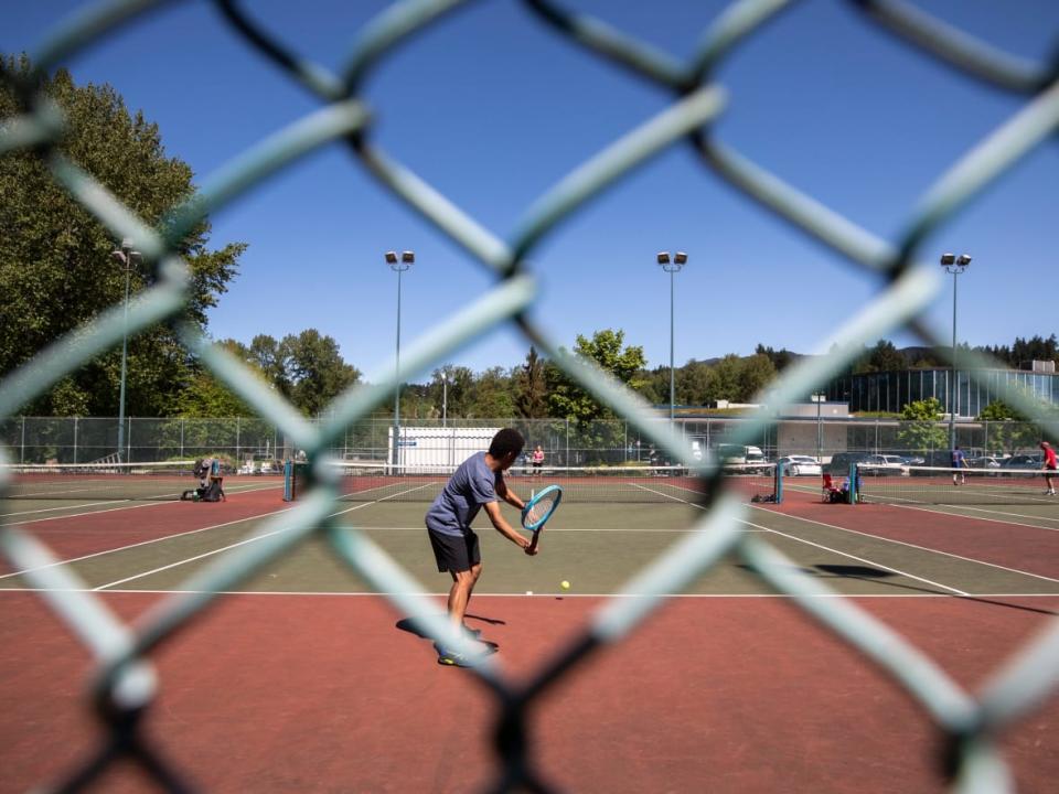 People play tennis at the Port Moody Recreational Complex in May 2020. Tennis B.C. CEO Mark Roberts says the growth of the sport accelerated during the pandemic. (Ben Nelms/CBC - image credit)