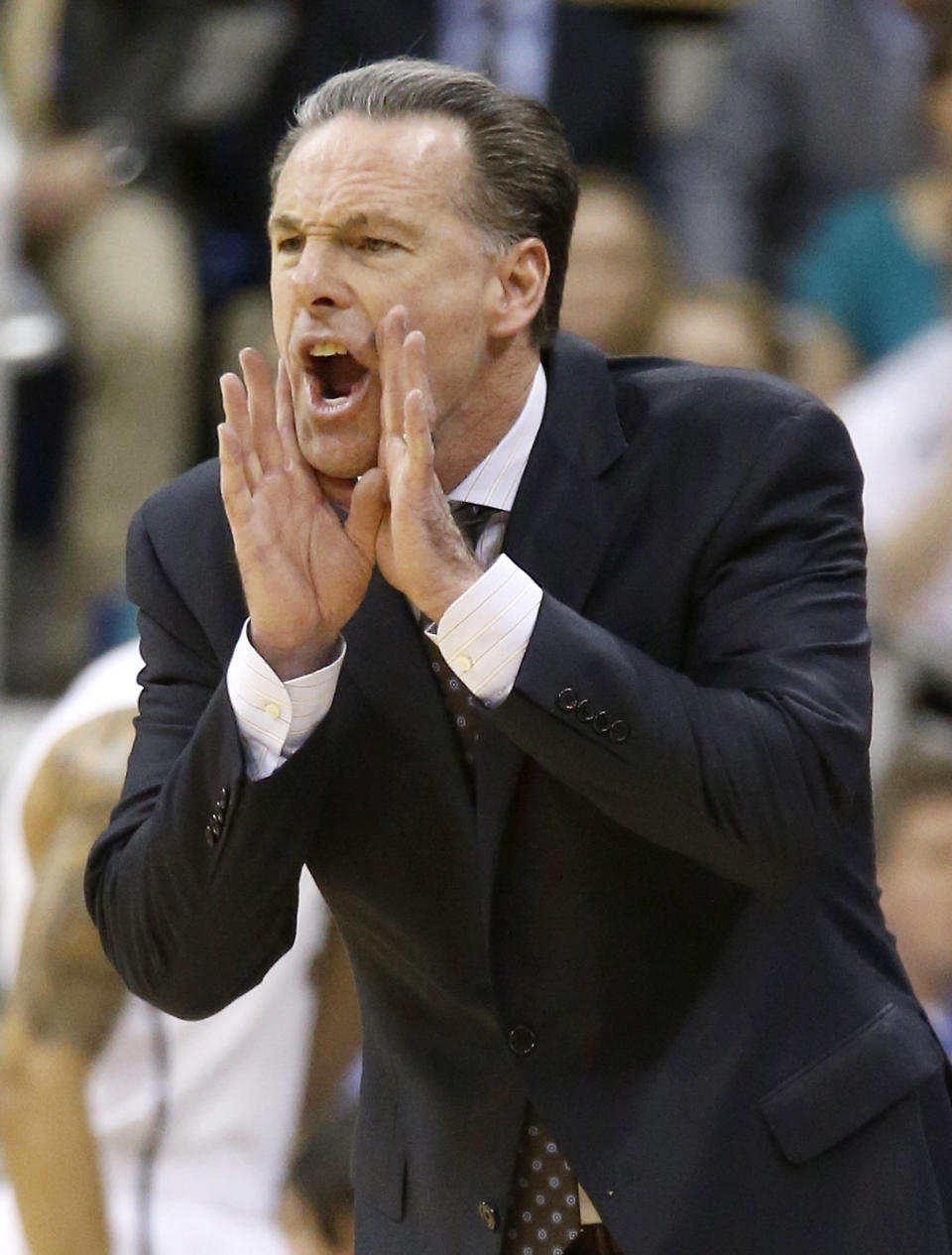 Pittsburgh coach Jamie Dixon yells to his team during the first half of an NCAA college basketball game against Syracuse on Wednesday, Feb. 12, 2014, in Pittsburgh. Syracuse won 58-56. (AP Photo/Keith Srakocic)