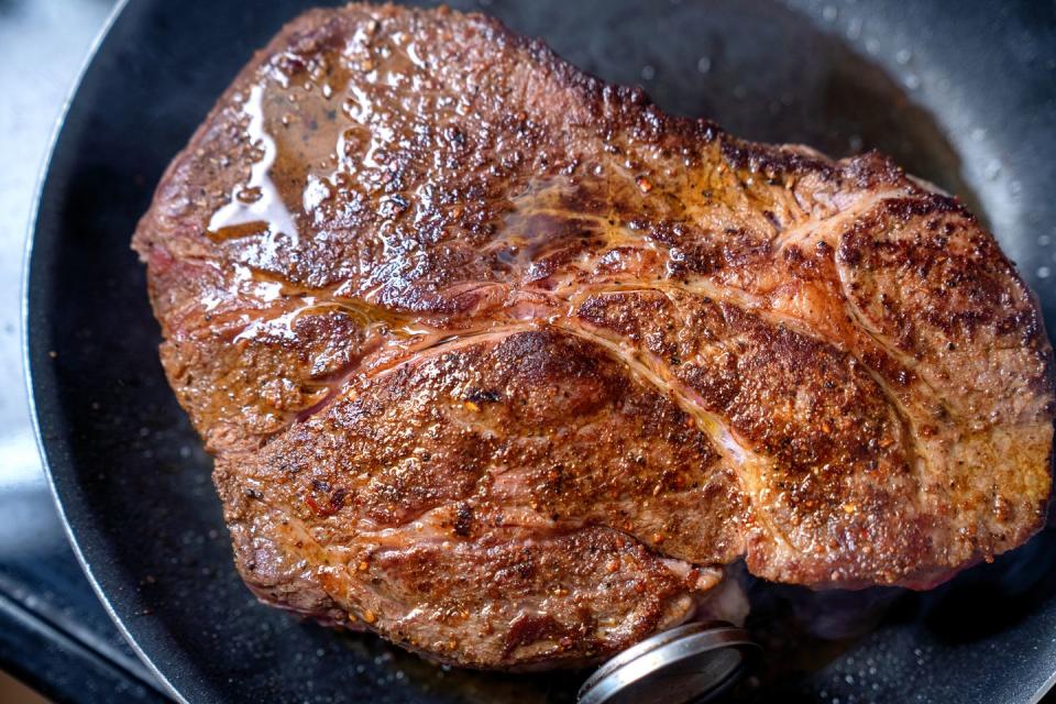 chuck beef roast being cooked in an oven with a meat thermometer to insure proper cooking temperature for the perfect ketogenic or carnivor diet meal