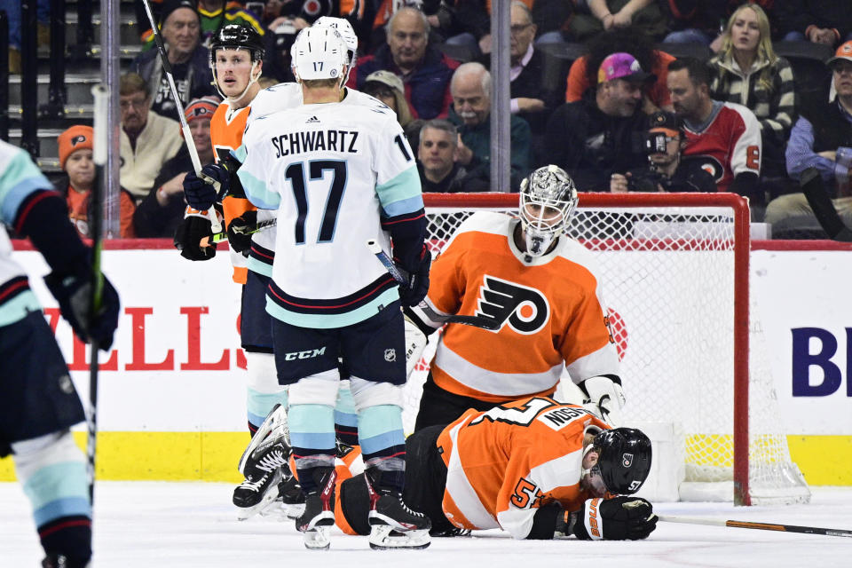 Seattle Kraken's Jaden Schwartz (17) celebrates with teammate Alex Wennberg after scoring a goal past Philadelphia Flyers goaltender Felix Sandstrom (32) during the second period an NHL hockey game, Sunday, Feb. 12, 2023, in Philadelphia. (AP Photo/Derik Hamilton)