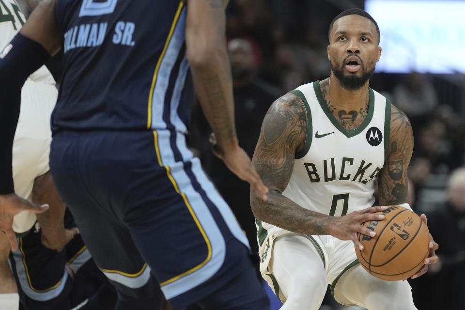 Milwaukee Bucks' Damian Lillard looks to shoot during the first half of a preseason NBA basketball game Friday, Oct. 20, 2023, in Milwaukee. (AP Photo/Morry Gash)