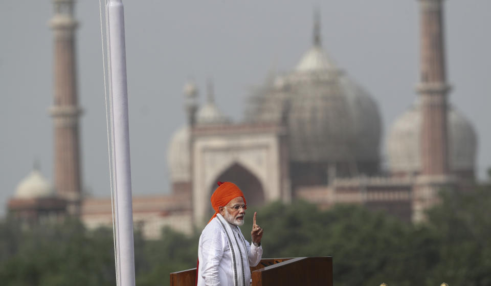 Indian Prime Minister Narendra Modi addresses to the nation on the country's Independence Day from the ramparts of the historical Red Fort in New Delhi, India, Wednesday, Aug. 15, 2018. India will send a manned flight into space by 2022, Modi announced Wednesday as part of India's independence day celebrations. He said India will become the fourth country after Russia, the United States and China to achieve the feat and its astronaut could be a man or a woman. The space capsule that will transport India's astronauts was tested a few days earlier. In the background, Jama Masjid Mosque is seen. (AP Photo/Manish Swarup)