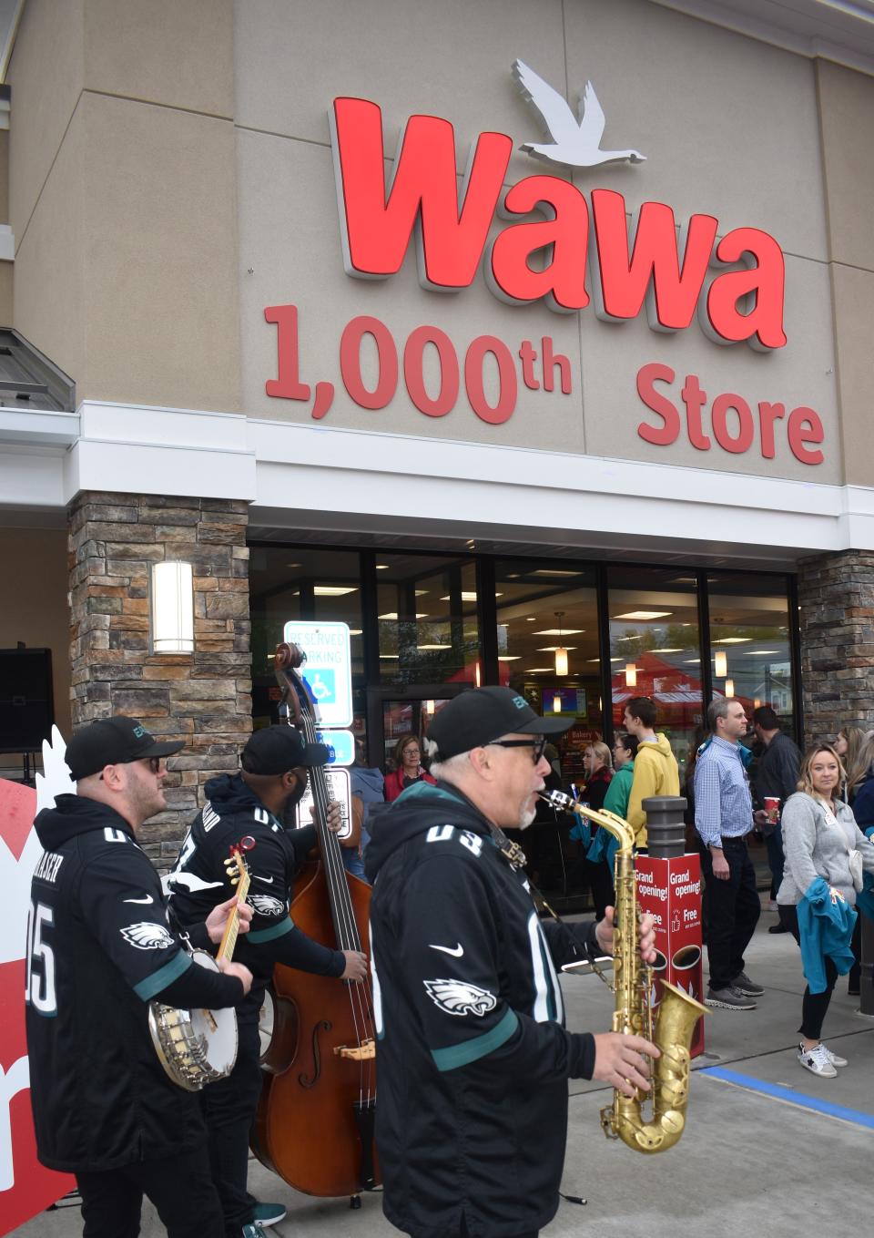 The Philadelphia Eagles pep band plays at the opening of Wawa's 1,000th store in Oaklyn on April 27, 2023.