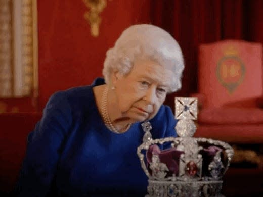 queen looking at crown