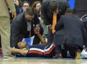 Mar 29, 2019; Kansas City, MO, United States; Auburn Tigers forward Chuma Okeke (5) is treated after suffering an apparent injury against the North Carolina Tar Heels during the second half in the semifinals of the midwest regional of the 2019 NCAA Tournament at Sprint Center. Mandatory Credit: Denny Medley-USA TODAY Sports