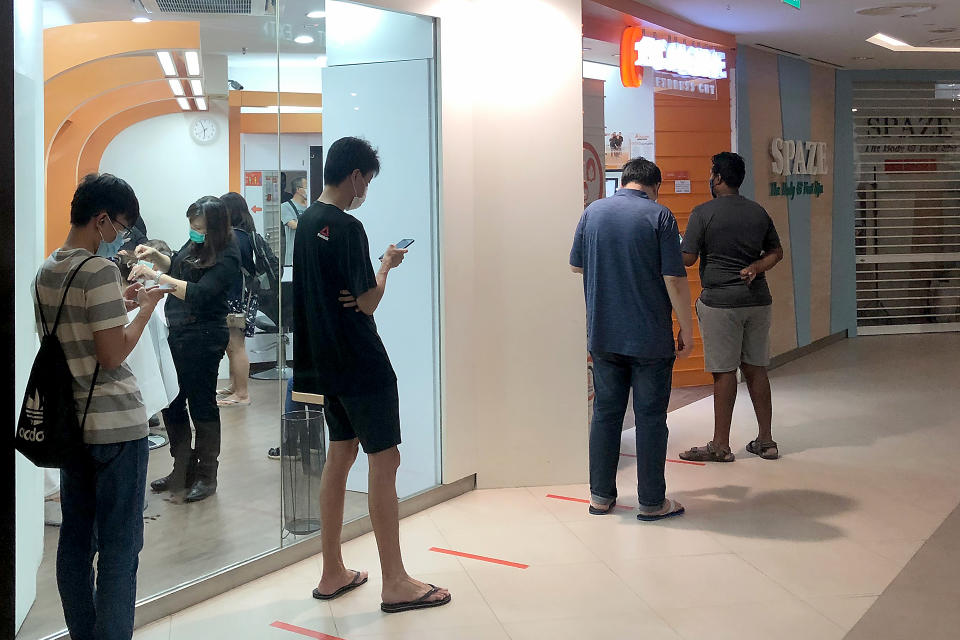 Queues seen as barbers, TCM retailers, dessert shops re-open