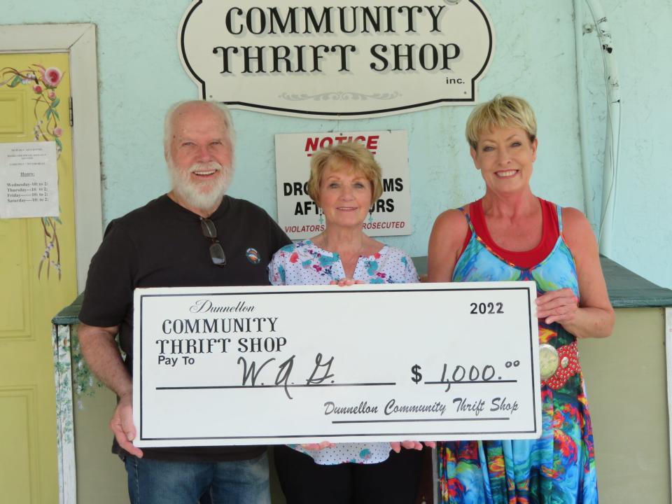 The Dunnellon Community Thrift Shop recently donated
$1,000 to the Williston Animal Group. From left: Tony Tatarka and Georgi Gunnell, Thrift Shop volunteers; and Carol Tchebanoff, WAG president.