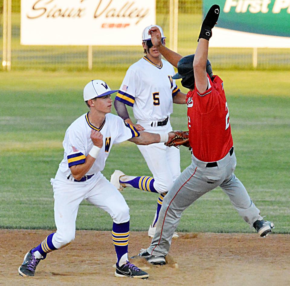 Watertown Post 17 second baseman Andrew Czech (left) tags out Brandon Valley base runner Matt Brown on a stolen-base attempt during their American Legion Baseball doubleheader Thursday at Watertown Stadium. Backing up the play is Watertown shortstop Will Engstrom. Brandon Valley swept the twinbill, winning 13-9 in eight innings and 10-1.