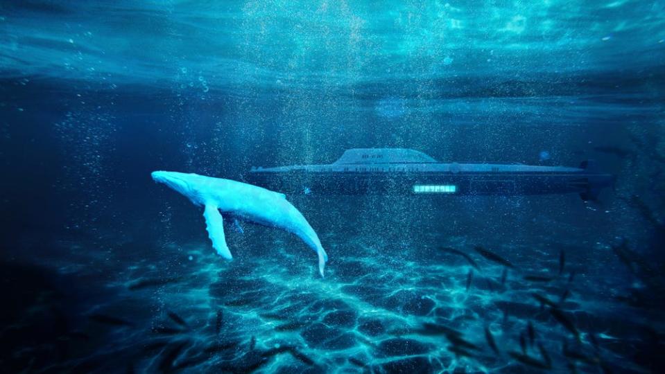 A promotional concept rendering for the proposed submersible superyacht the Migaloo M5, viewed from under shallow waters with a whale in the foreground.
