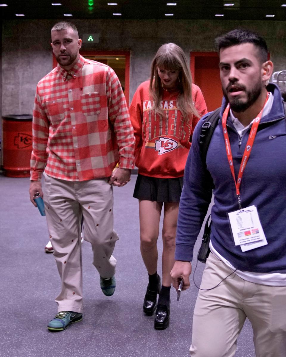 Kansas City Chiefs tight end Travis Kelce, left, and singer Taylor Swift leave Arrowhead Stadium after the Chiefs game against the Los Angeles Chargers on Sunday, Oct. 22, 2023, in Kansas City, Missouri.