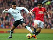 <p>Liverpool’s Alex Oxlade-Chamberlain (left) and Manchester United Alexis Sanchez battle for the ball – both were Arsenal team mates until this season </p>