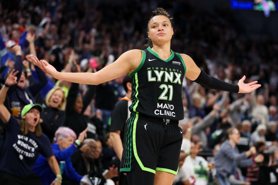 The Minnesota Lynx's Kayla McBride, an Erie native, celebrates her 3-pointer against the Connecticut Sun during the first half at Target Center on Tuesday. The Lynx won 88-77 to advance to the WNBA Finals.