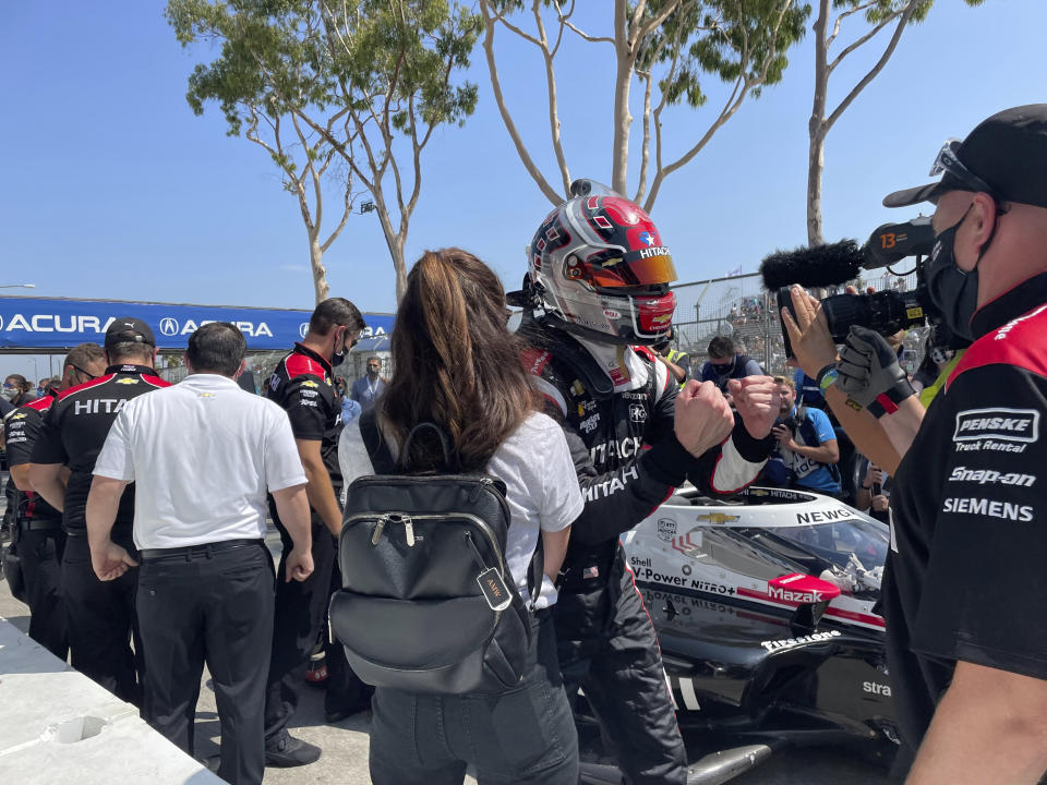 American driver Josef Newgarden celebrates after winning the pole for the Grand Prix of Long Beach, Saturday, Sept. 25, 2021, in Long Beach, Calif. The Sunday race on the downtown street circuit will crown the IndyCar champion and Newgarden sits third in the standings, behind leader Alex Palou of Spain and Pato O'Ward of Mexico. (AP Photo/Jenna Fryer)