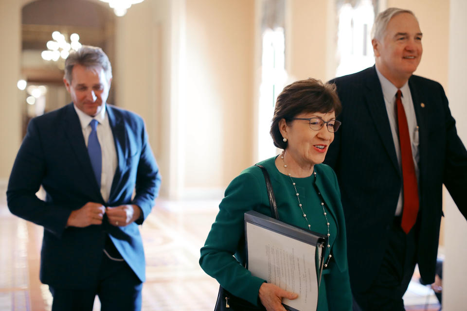 Sen. Jeff Flake (R-Ariz.), left, and Sen. Susan Collins (R-Maine), center, did not change their votes after meeting with Barkan. But he forced them to view his frailty before voting "yes." (Photo: Chip Somodevilla/Getty Images)