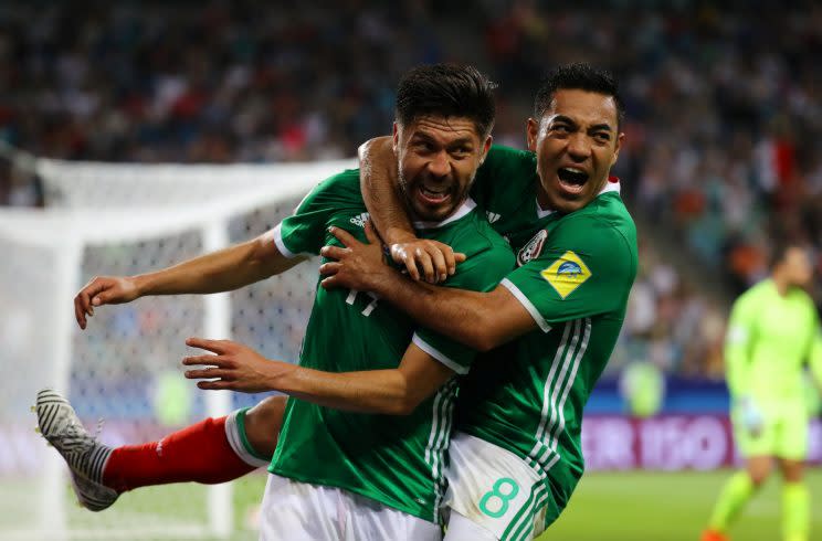 Oribe Peralta, left, celebrates scoring the game-winning goal against New Zealand with Marco Fabian. (Reuters)