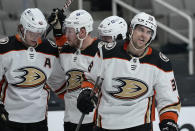 Anaheim Ducks center Derek Grant, right, smiles after scoring a goal against the San Jose Sharks during the second period of an NHL hockey game Wednesday, April 14, 2021, in San Jose, Calif. (AP Photo/Tony Avelar)