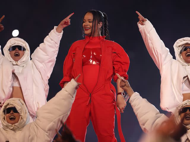 <p>Gregory Shamus/Getty</p> Rihanna performs onstage during the Apple Music Super Bowl LVII Halftime Show at State Farm Stadium on February 12, 2023.