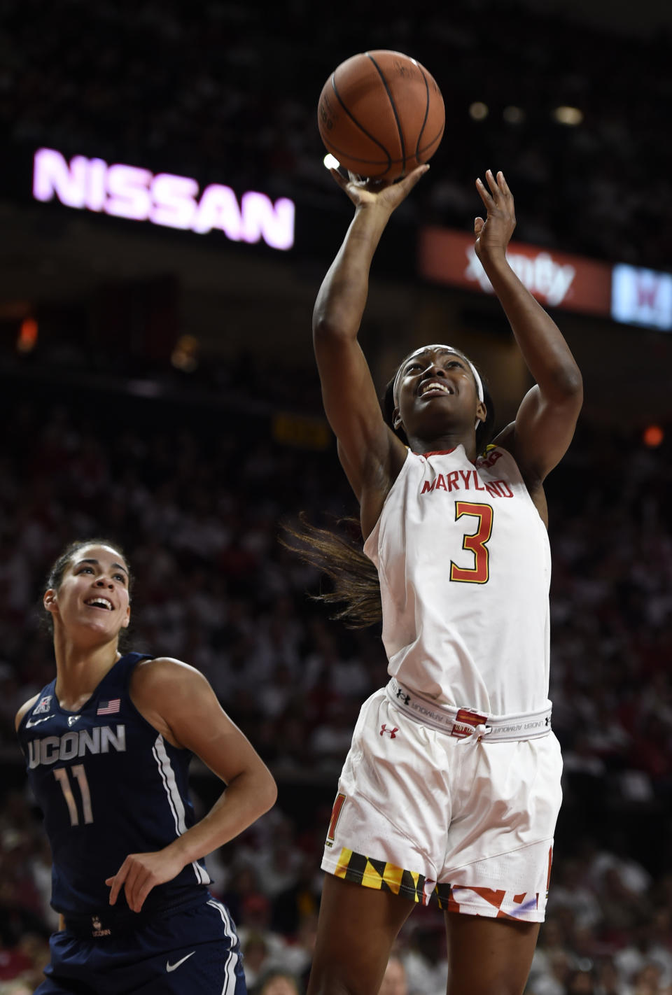 Maryland's Kaila Charles, right, shoots as Connecticut's Kia Nurse looks on during the first half of an NCAA college basketball game, Thursday, Dec. 29, 2016, in College Park, Md. (AP Photo/Gail Burton)