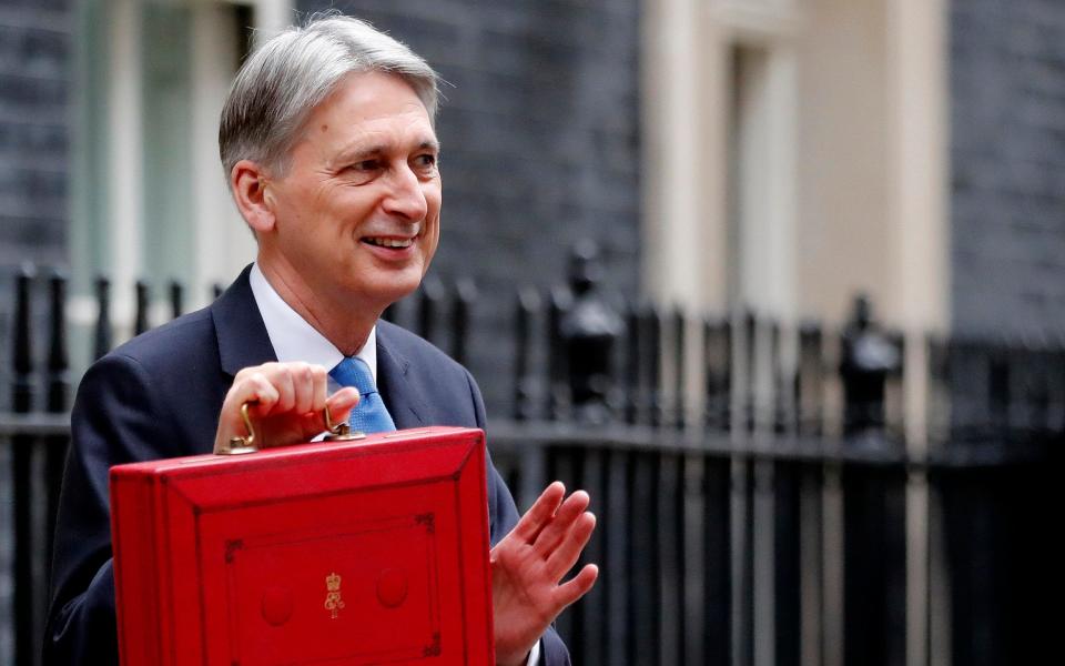 A stark choice between politically acceptable spending levels for quality services, or meeting fiscal rules, faces Chancellor Philip Hammond, according to economists - AP