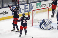 Columbus Blue Jackets players celebrate their goal against the Tampa Bay Lightning during the first period of an NHL hockey game Saturday, Jan. 23, 2021, in Columbus, Ohio. (AP Photo/Jay LaPrete)