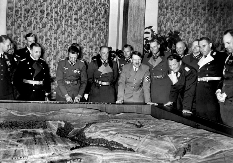 <div class="inline-image__caption"><p>In 1939 Adolf Hitler and high-ranking Nazi officers including Commander-in-Chief of the Luftwaffe Hermann Goering (4th R) and Commander in Chief of the German Navy Erich Raeder (2nd L) looking at the three-dimensional map of some countryside. </p></div> <div class="inline-image__credit">AFP/Getty</div>