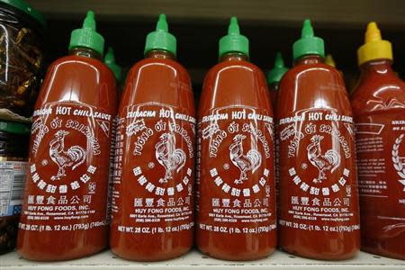 Bottles of Sriracha hot chili sauce, made by Huy Fong Foods, are seen on a supermarket shelf in San Gabriel, California October 30, 2013. REUTERS/Lucy Nicholson