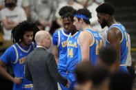 UCLA coach Mick Cronin confers with players during the second half of an NCAA college basketball game against Colorado on Saturday, Jan. 22, 2022, in Boulder, Colo. UCLA won 71-65. (AP Photo/David Zalubowski)