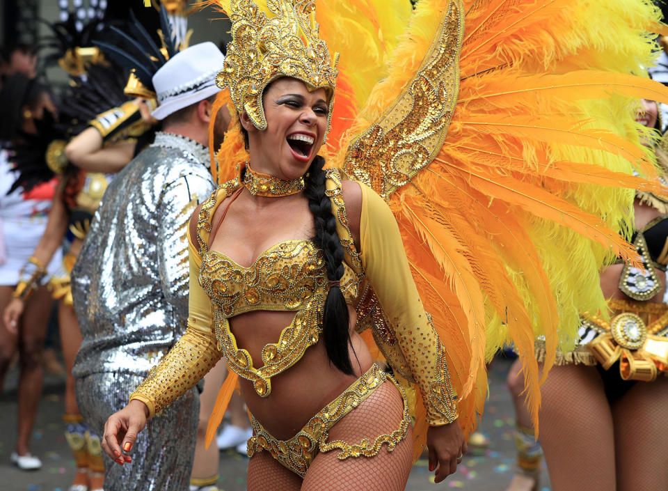 <p>A reveler takes part in the Monday parade, during the second and final day of the Notting Hill Carnival, in London, Monday Aug. 29, 2016. (Jonathan Brady/PA via AP) </p>