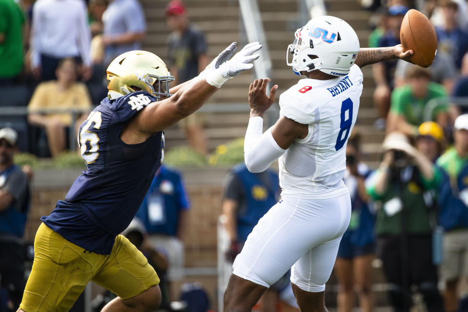 FILE - Notre Dame's Howard Cross III (56) pressures Tennessee State's Deveon Bryant (8) during the first half of an NCAA college football game on Saturday, Sept. 2, 2023, in South Bend, Ind. Cross III has been selected to The Associated Press midseason All-America team, Wednesday, Oct. 18, 2023.(AP Photo/Michael Caterina, File)