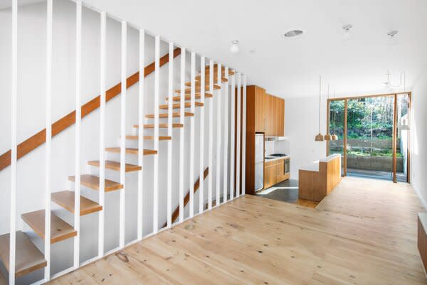 Hardwood floors line the main living areas housed on the middle level.