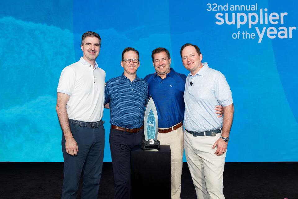 Axalta's Dan Naugle (VP, Mobility Americas), Rob Schnell (VP, Global Product Strategy and Commercial Operations) and Dagan Brush (Global Business Director) along with a GM representative at General Motors' annual Supplier of the Year recognition event in Miami.