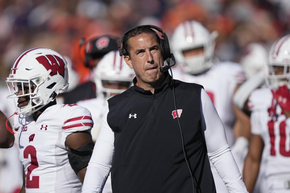 FILE - Wisconsin head coach Luke Fickell looks at the scoreboard during an NCAA college football game against Illinois Saturday, Oct. 21, 2023, in Champaign, Ill. (AP Photo/Charles Rex Arbogast, File)