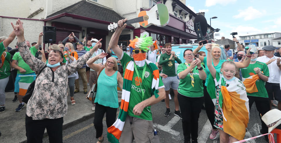 Republic of Ireland fans gather to sing the Ireland world cup anthem "Put em under pressure" at 12:30 Walkinstown Roundabout in Dublin as Jack Charltons funeral comes to a close in Newcastle England.