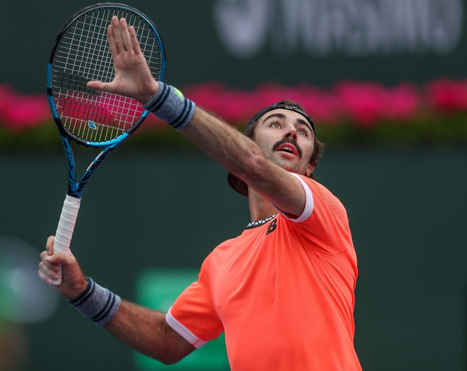 Jordan Thompson hits a shot during his match against Stefanos Tsitipas during the BNP Paribas Open in Indian Wells, Calif., March 10, 2023. 