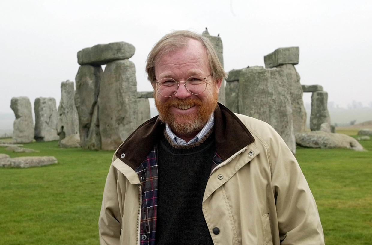 American author Bill Bryson, poses at Stonehenge, the stone circle, near Salisbury in Wiltshire,England, Friday, Dec.19, 2003. Bryson has been recently appointed an English Heritage Commisioner and his brief is to make the historic site more accessible and increase visitor access. His non-fiction "A Short History of Nearly Everything,'' is currently on best seller lists. (AP Photo/Dave Caulkin)