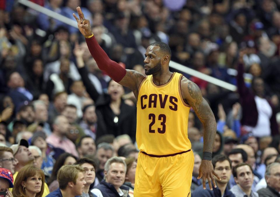 FILE - In this Feb. 6, 2017, file photo, Cleveland Cavaliers forward LeBron James gestures after he scored a basket during the second half of an NBA basketball game against the Washington Wizards in Washington. The Cavaliers got back to championship form in February. The NBA champions went 9-2, a nice turnaround after going 7-8 in January, when James called the team's roster "top heavy" and asked for help. (AP Photo/Nick Wass, File)