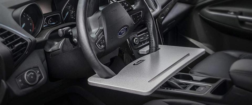 AutoExec Wheelmate Steering Wheel Attachable Work Surface Tray in use in someone's car