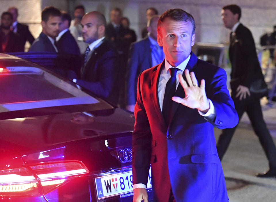 French President Emmanuel Macron waves when arriving at the informal EU summit in Salzburg, Austria, Wednesday, Sept. 19, 2018. (AP Photo/Kerstin Joensson)