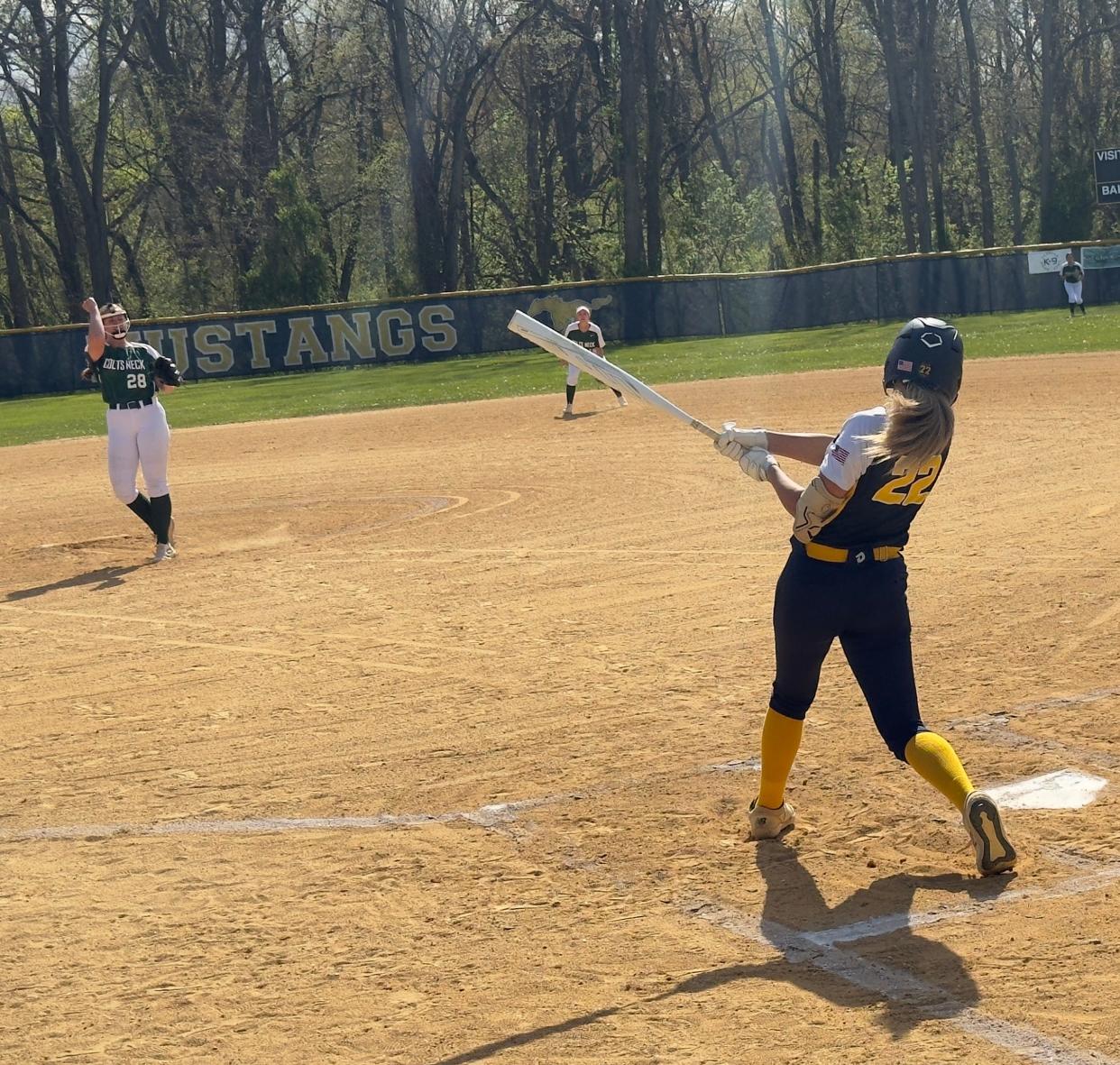 Colts Neck pitcher Angela Sasso (left) gets a strikeout against Marlboro