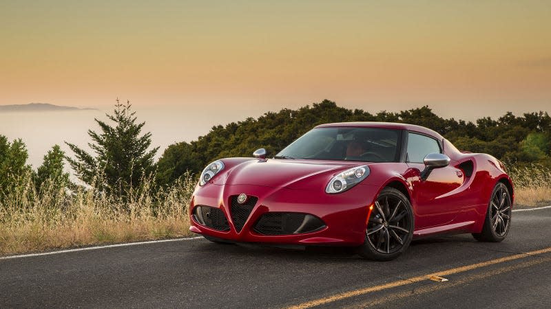 A photo of a red Alfa Romeo 4c sports car. 