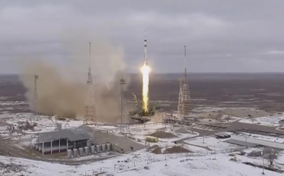 In this photo taken from video footage released by the Roscosmos Space Agency, the Soyuz-2.1a rocket booster with Soyuz MS-20 space ship carrying Russian cosmonaut Alexander Misurkin, spaceflight participants Yusaku Maezawa and Yozo Hirano of Japan to the International Space Station, ISS, blasts off at the Russian leased Baikonur cosmodrome, Kazakhstan, Wednesday, Dec. 8, 2021. (Roscosmos Space Agency via AP)